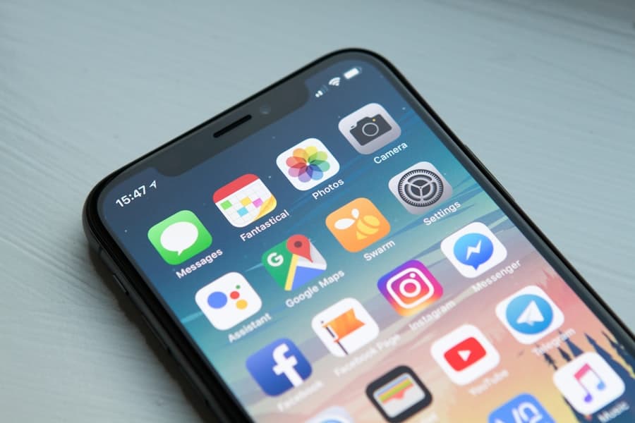 A banking app open on a smartphone held in hand